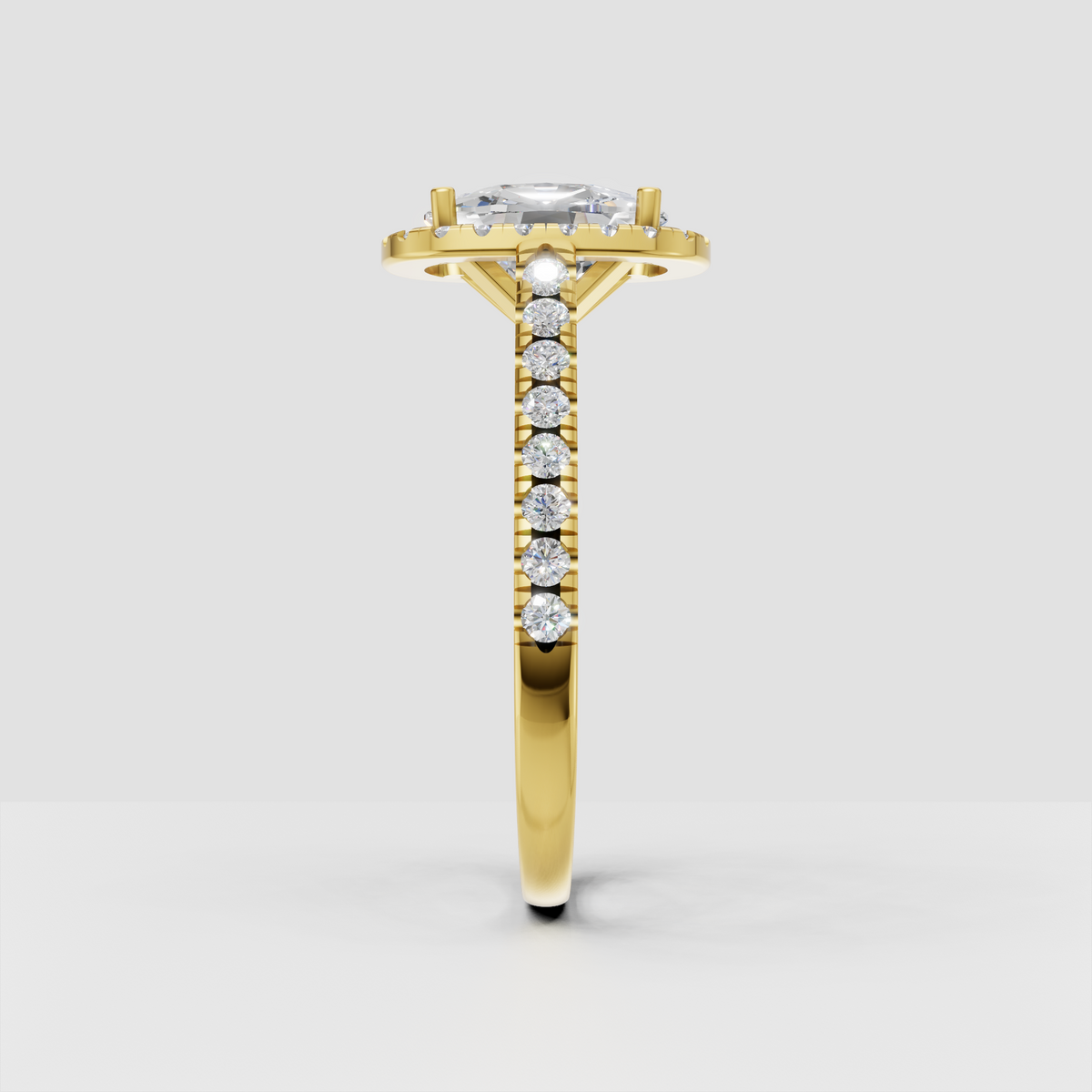 Yellow gold elongated cushion cut diamond halo ring with diamond accented shoulders