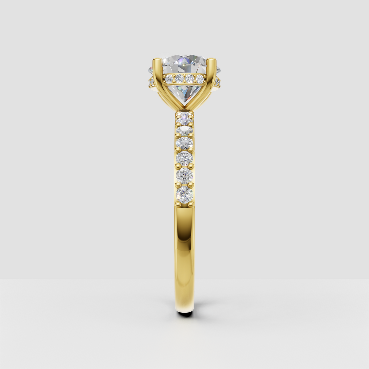 Yellow gold round diamond cathedral ring with sparkling shoulder stones