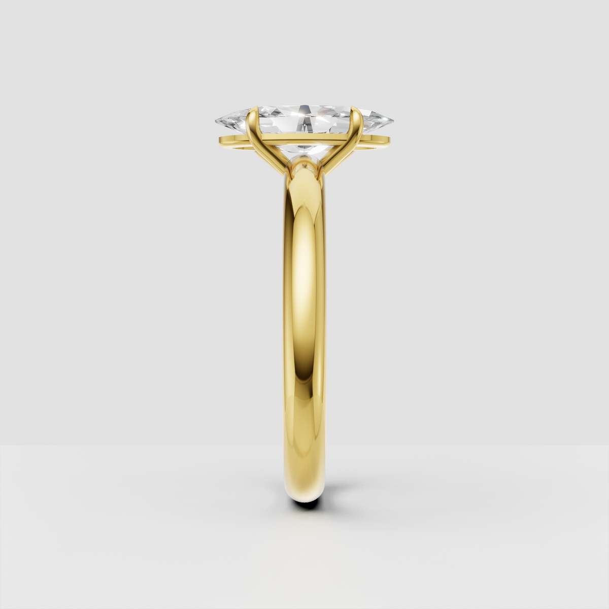 Elegant oval diamond engagement ring with polished yellow-gold solitaire setting