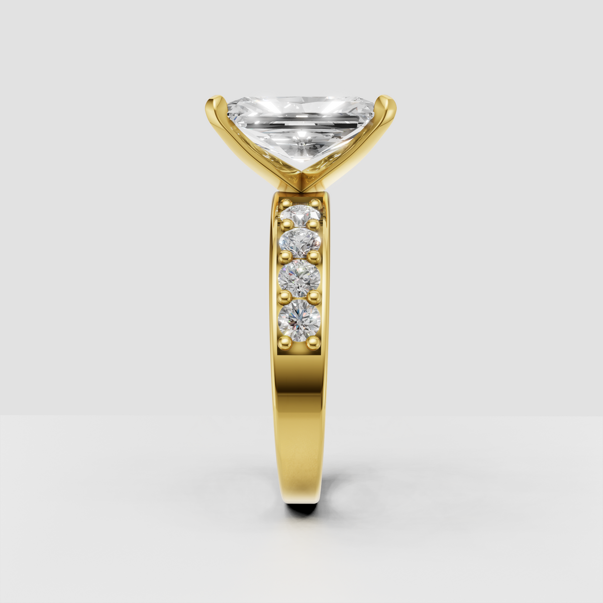 Radiant-cut center stone ring with sparkling round side diamonds
