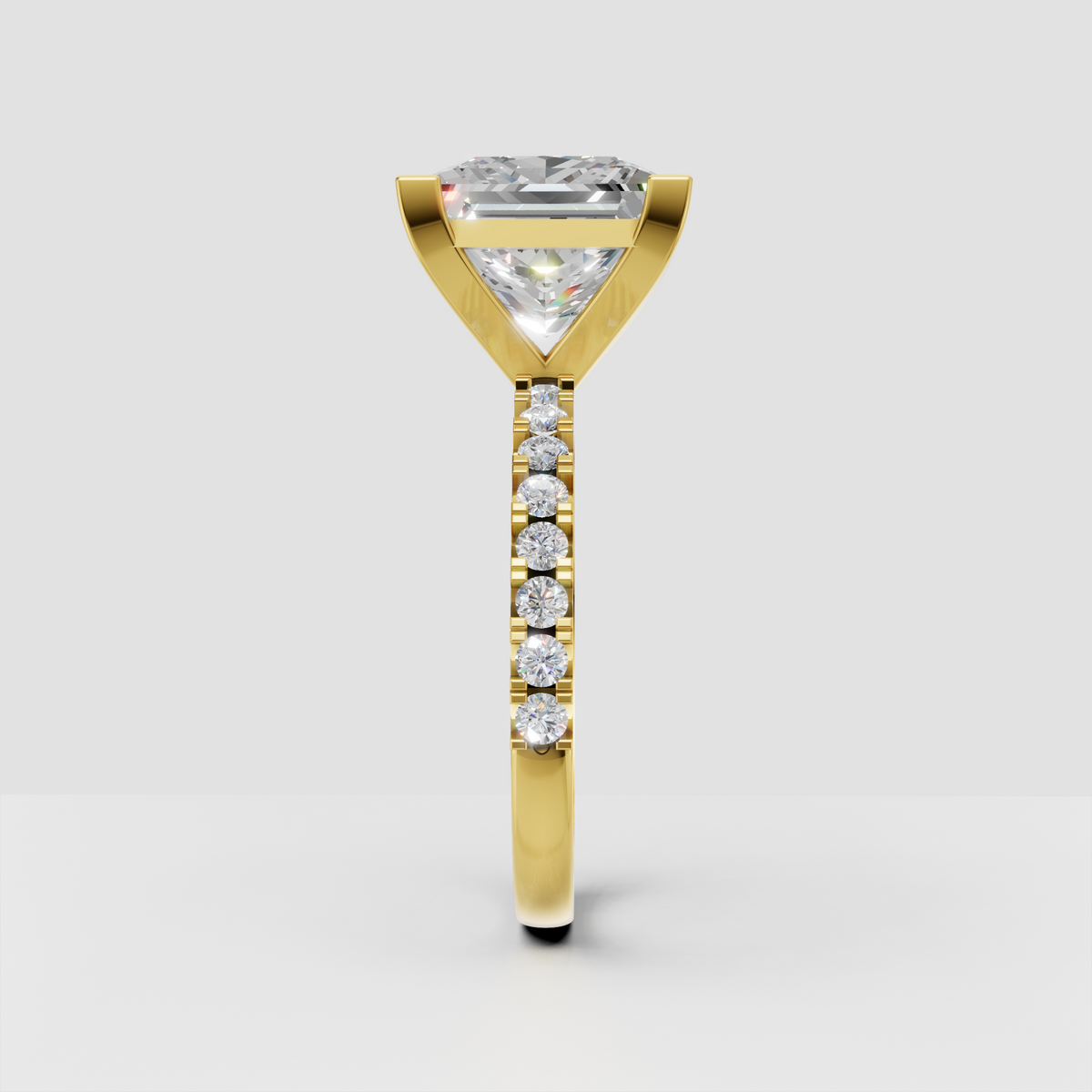 Yellow gold princess cut engagement ring with pave diamond band