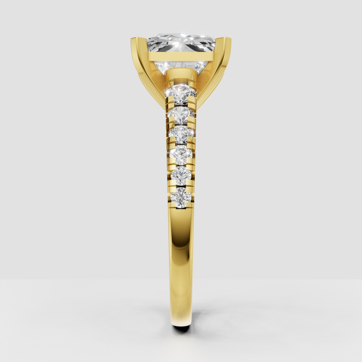 Yellow gold radiant diamond ring with four square-tipped prongs