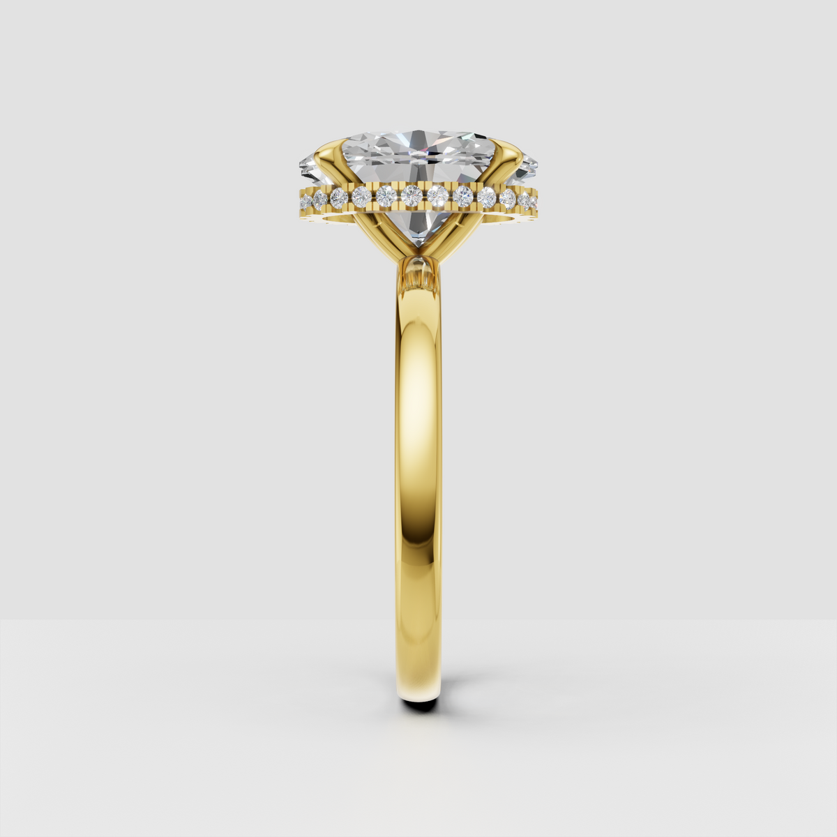 Yellow gold oval engagement ring with hidden diamond halo