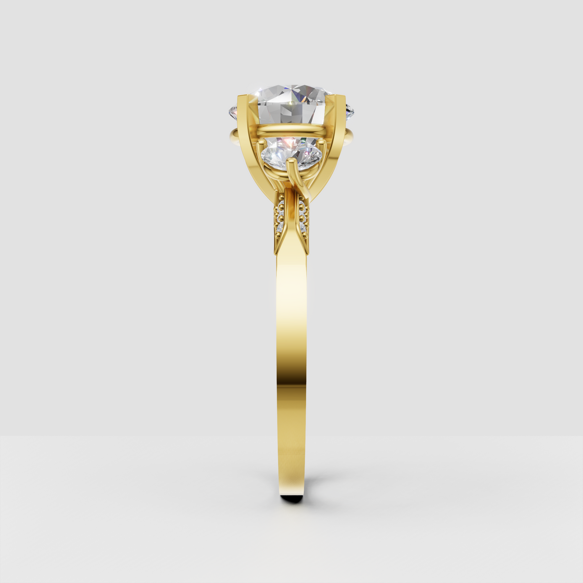 Round brilliant diamond ring with matching round side stones