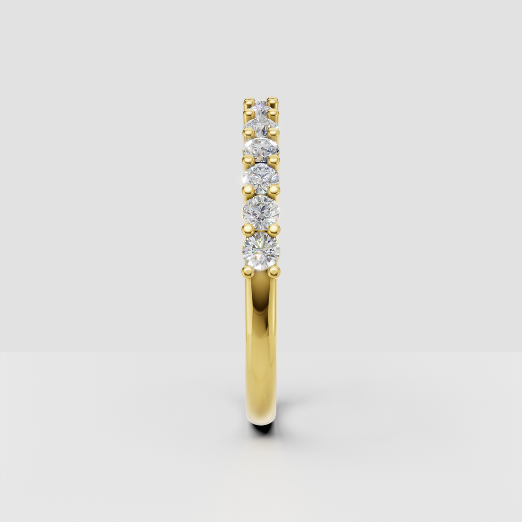 Yellow gold half eternity ring with round diamond stones