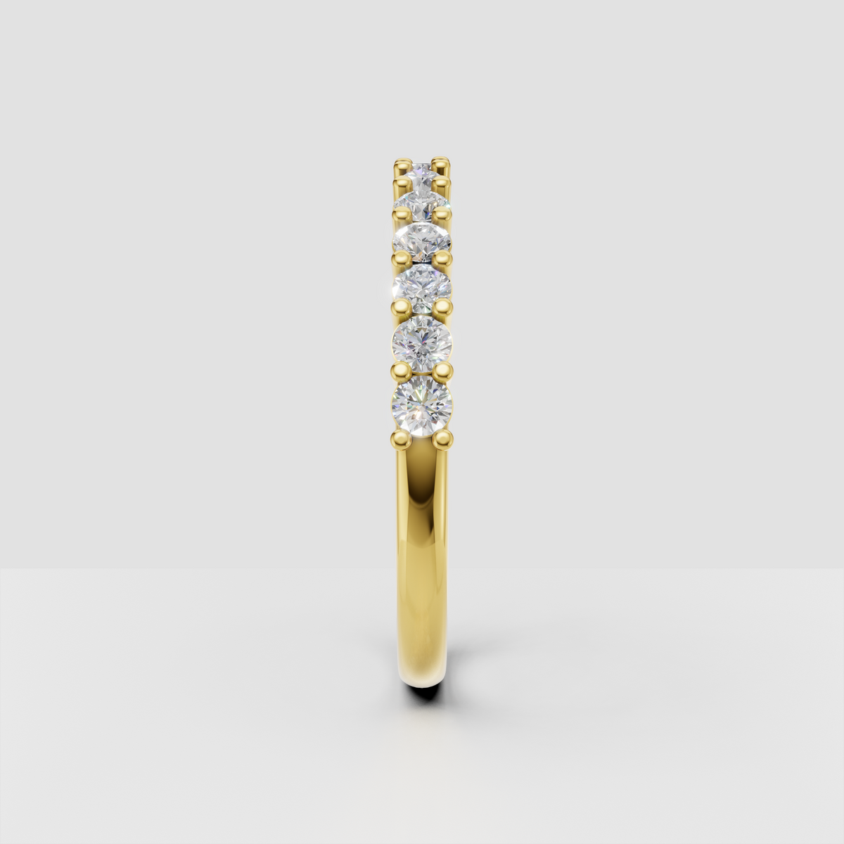 Yellow gold half eternity ring with round diamond stones