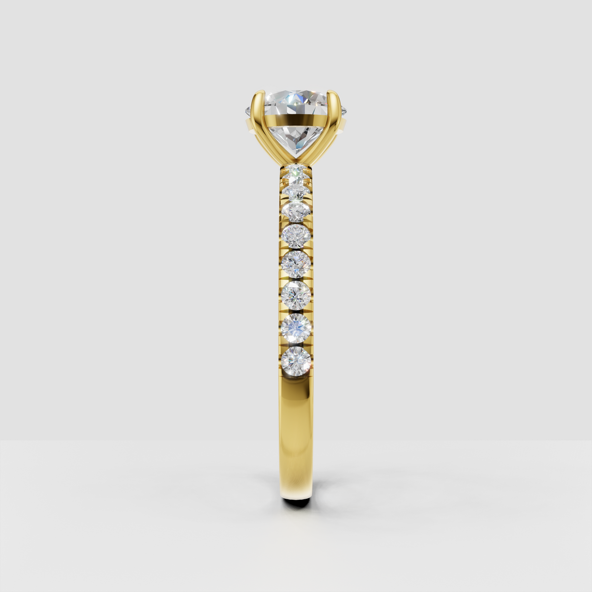 Round cut diamond ring with delicate pavé side stones