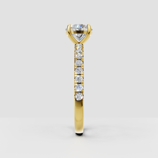 Round cut diamond ring with delicate pavé side stones