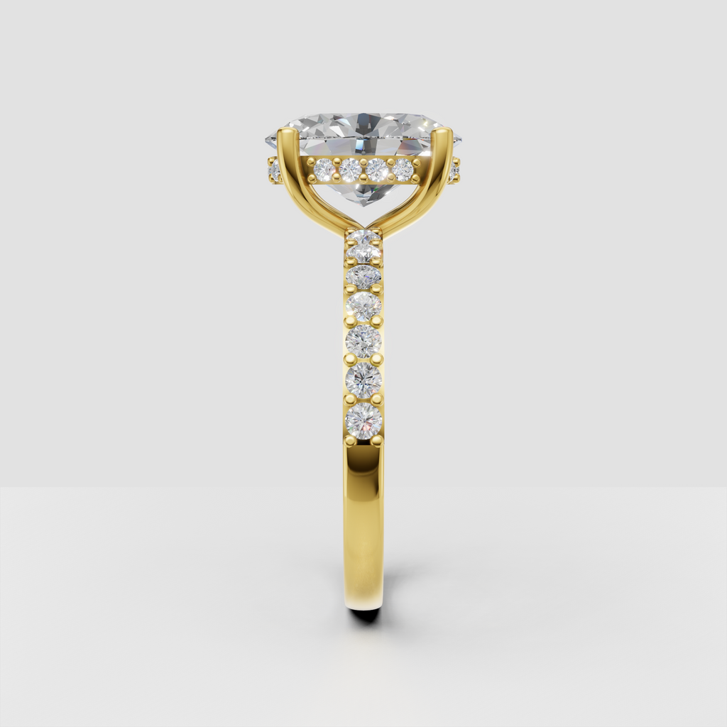 Oval cut hidden halo ring featuring a delicate pavé band