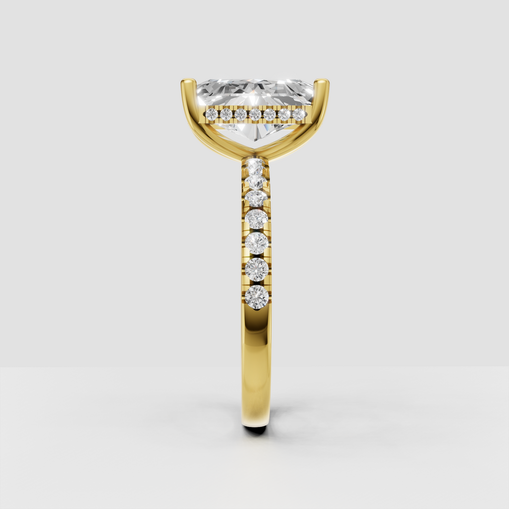Yellow gold radiant diamond engagement ring with pavé band