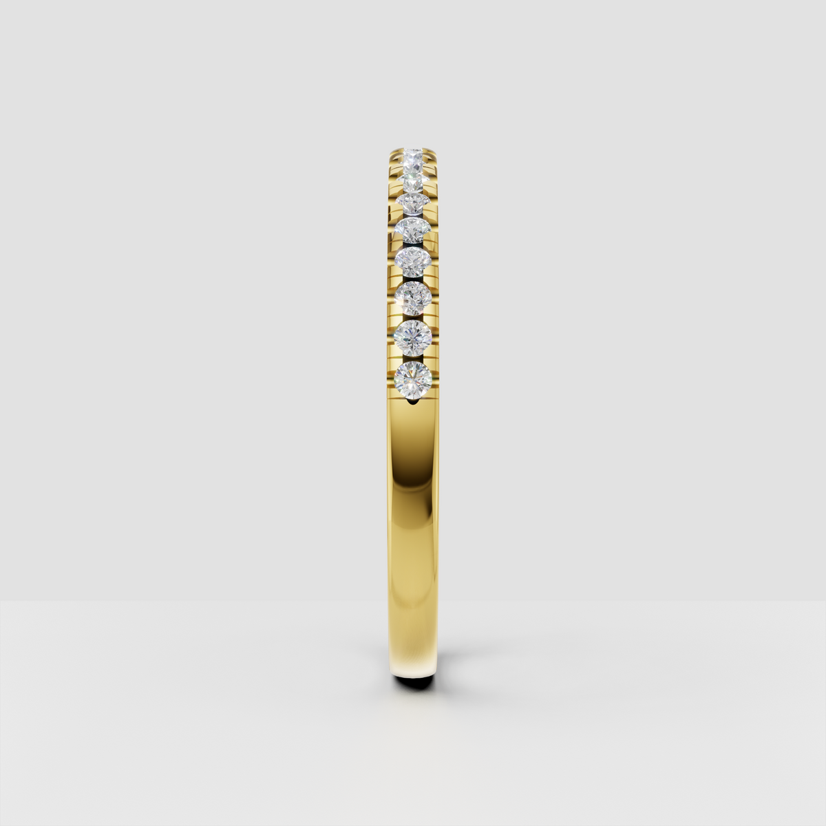 Gold round diamond band ring featuring continuous upper-row stones