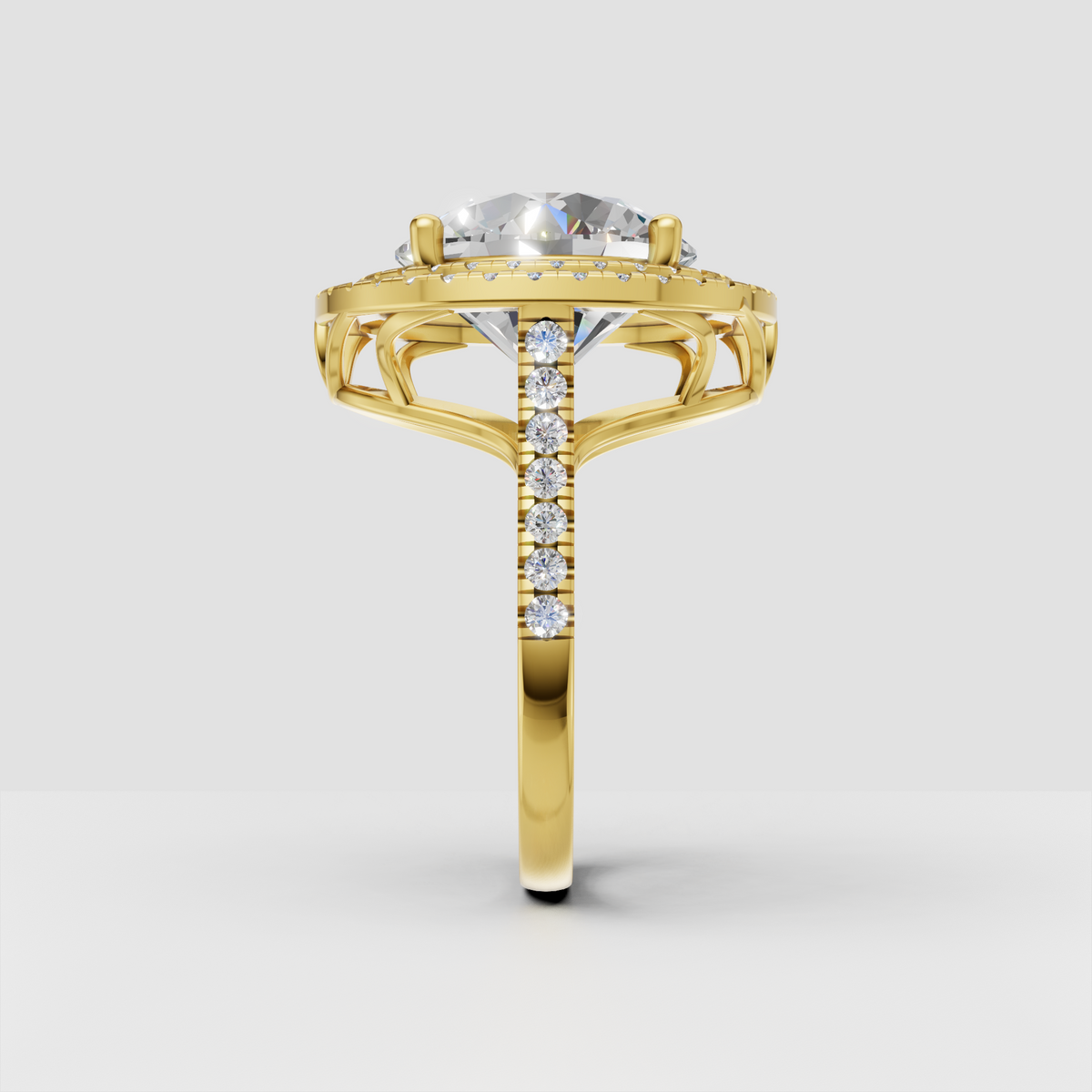 Round diamond halo ring with pave set shoulders