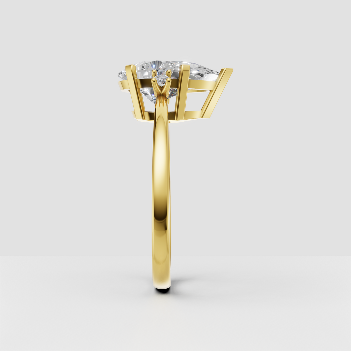 Yellow gold pear cut three stone diamond ring