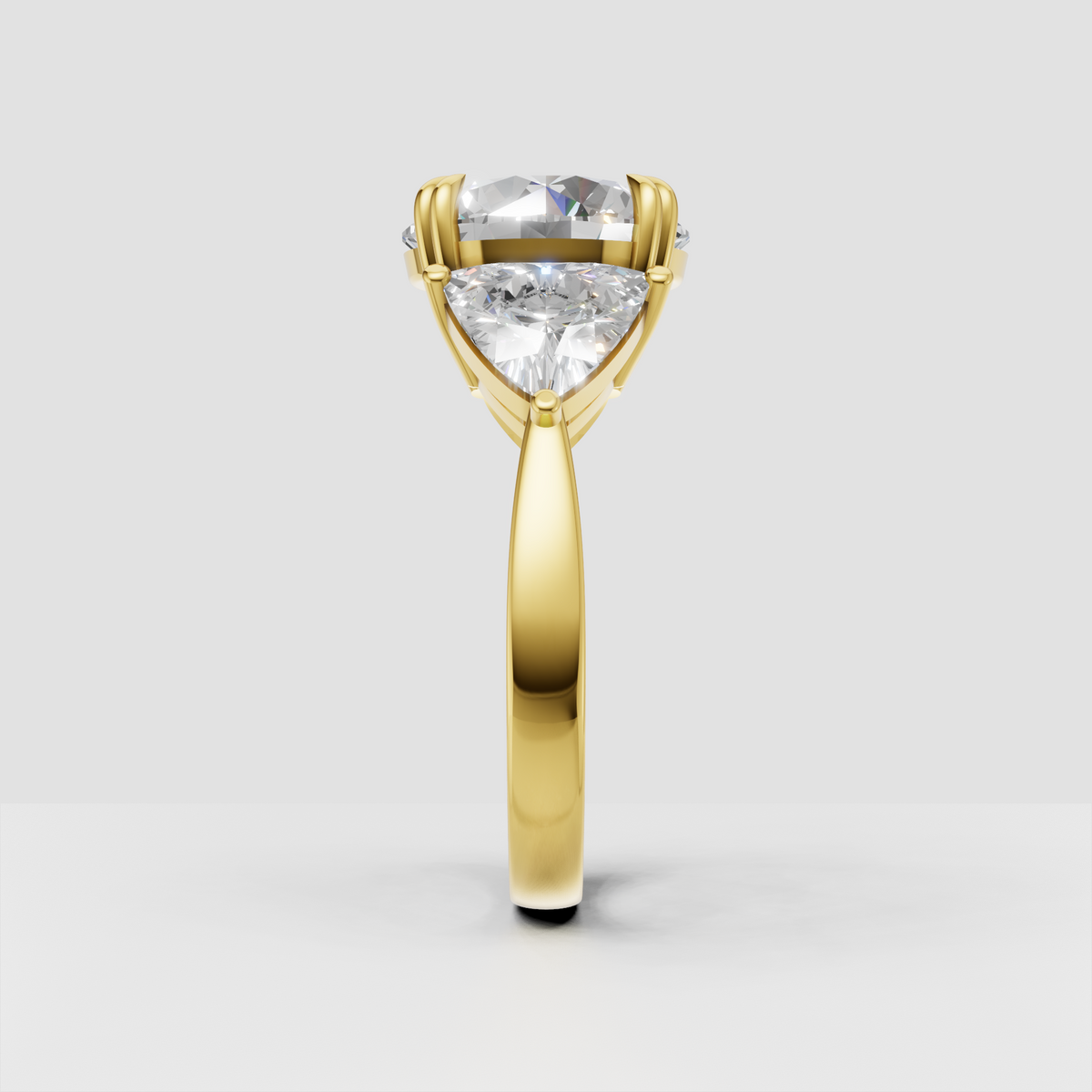 Yellow gold round cut diamond engagement ring with three stone design
