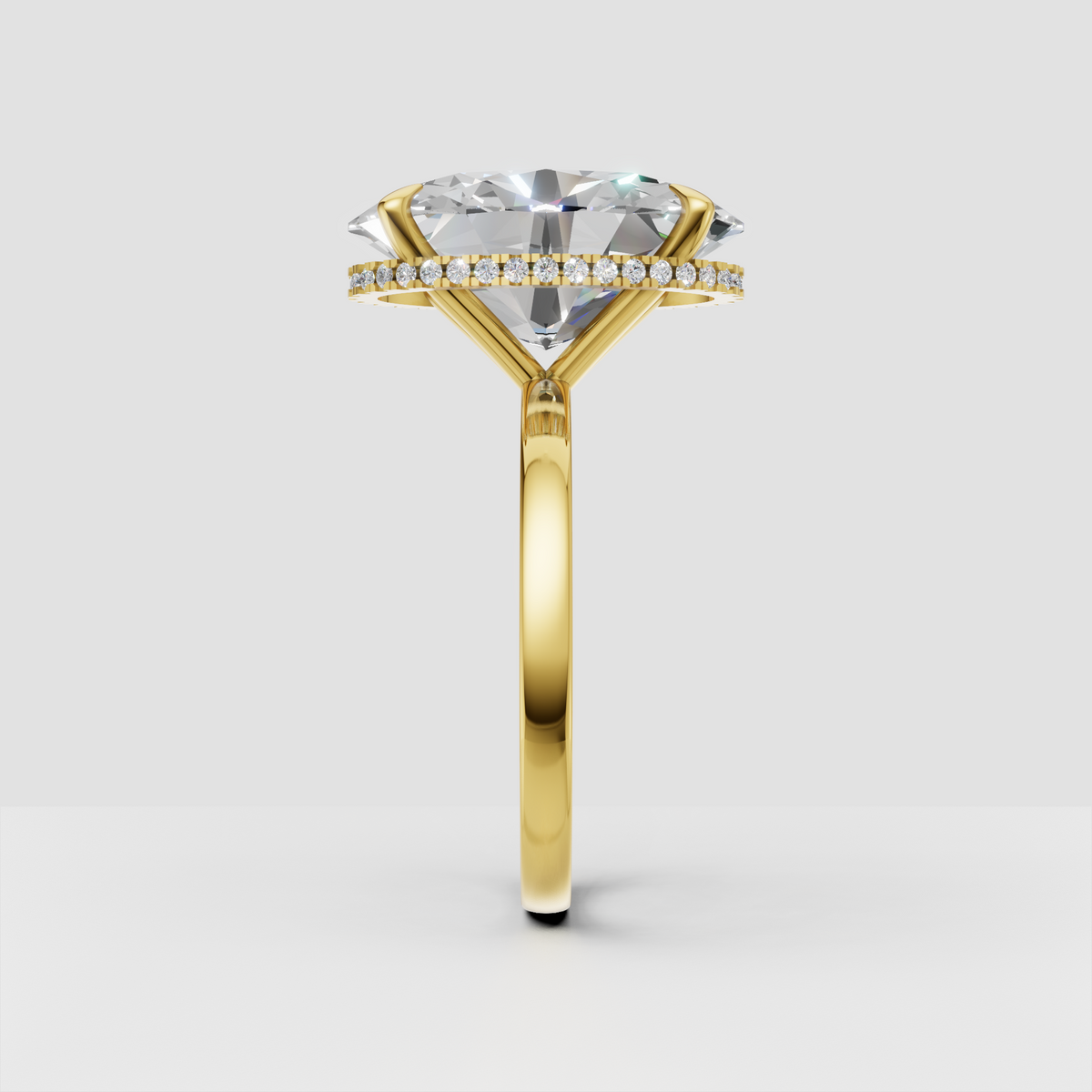 Oval cut diamond ring featuring a hidden halo beneath center stone