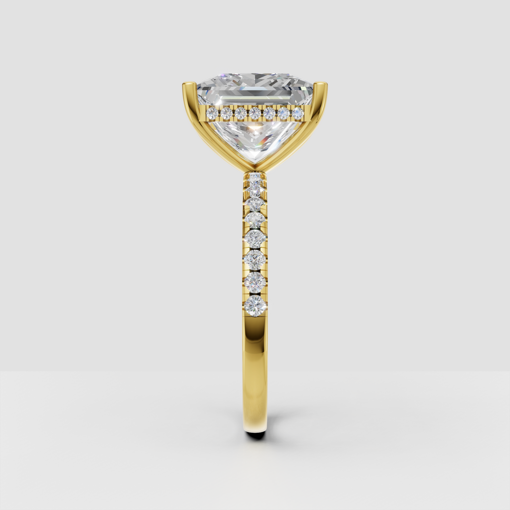 Elegant princess cut diamond solitaire ring with slim pave diamond band.