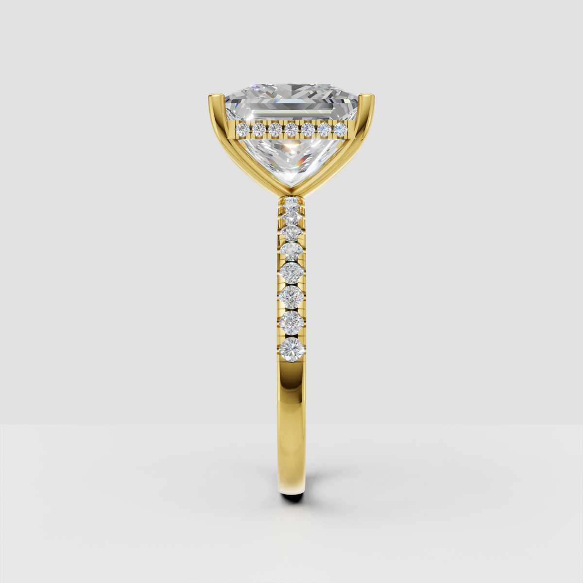 Elegant princess cut diamond solitaire ring with slim pave diamond band.