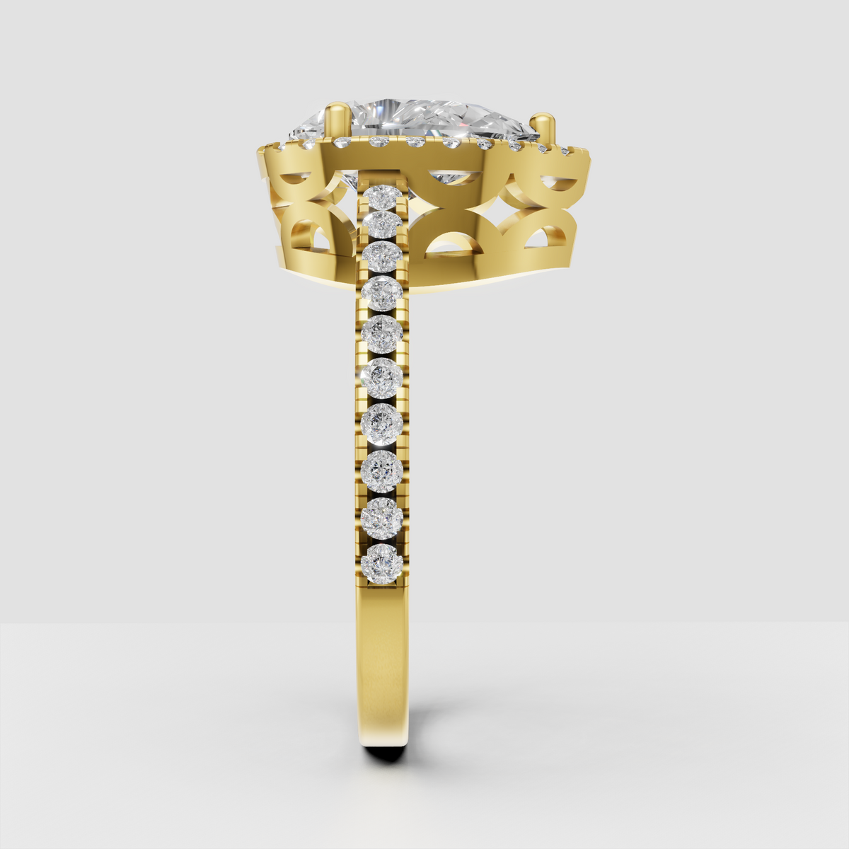 Yellow gold pear-shaped diamond ring with halo setting