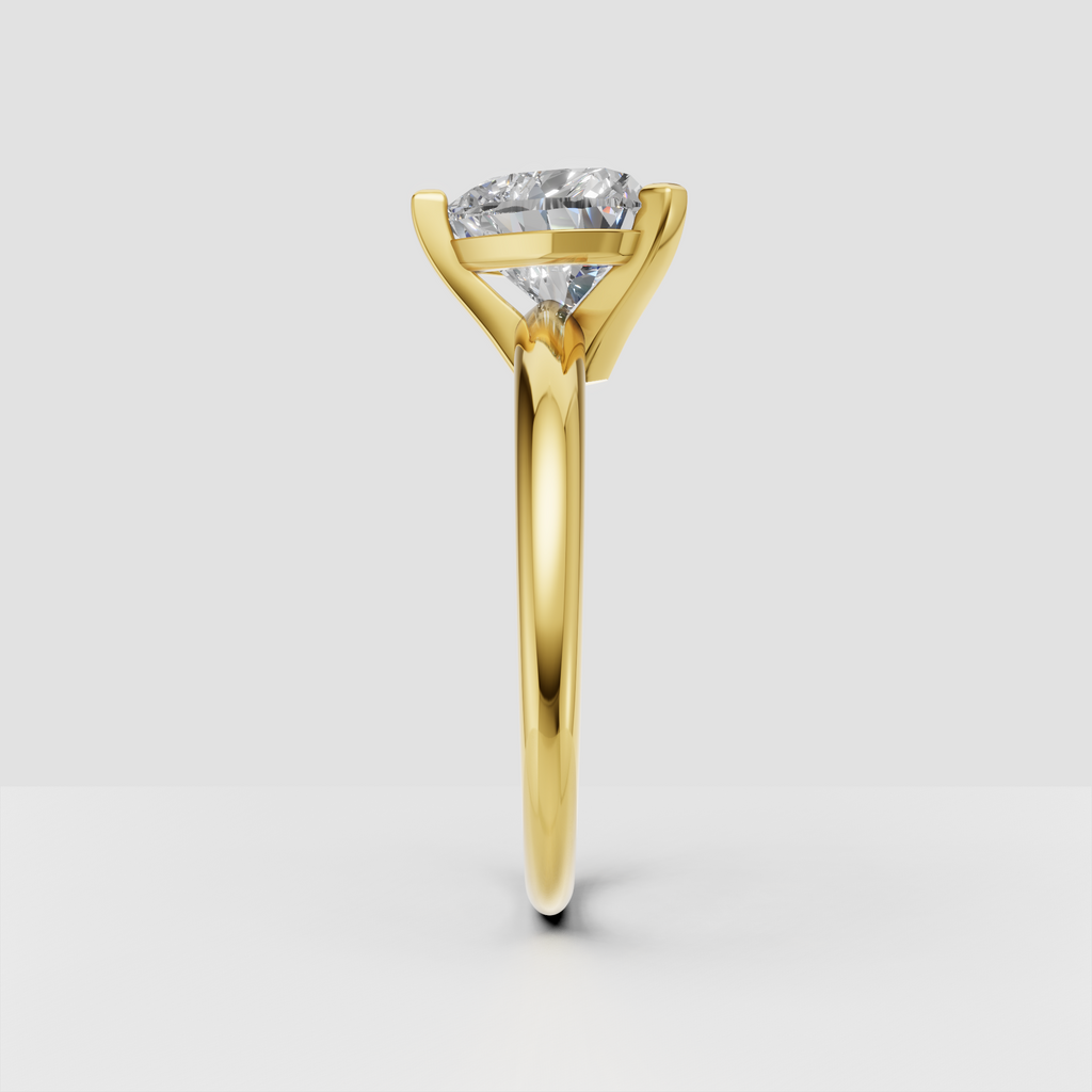 Yellow gold heart cut diamond solitaire ring with three prong setting