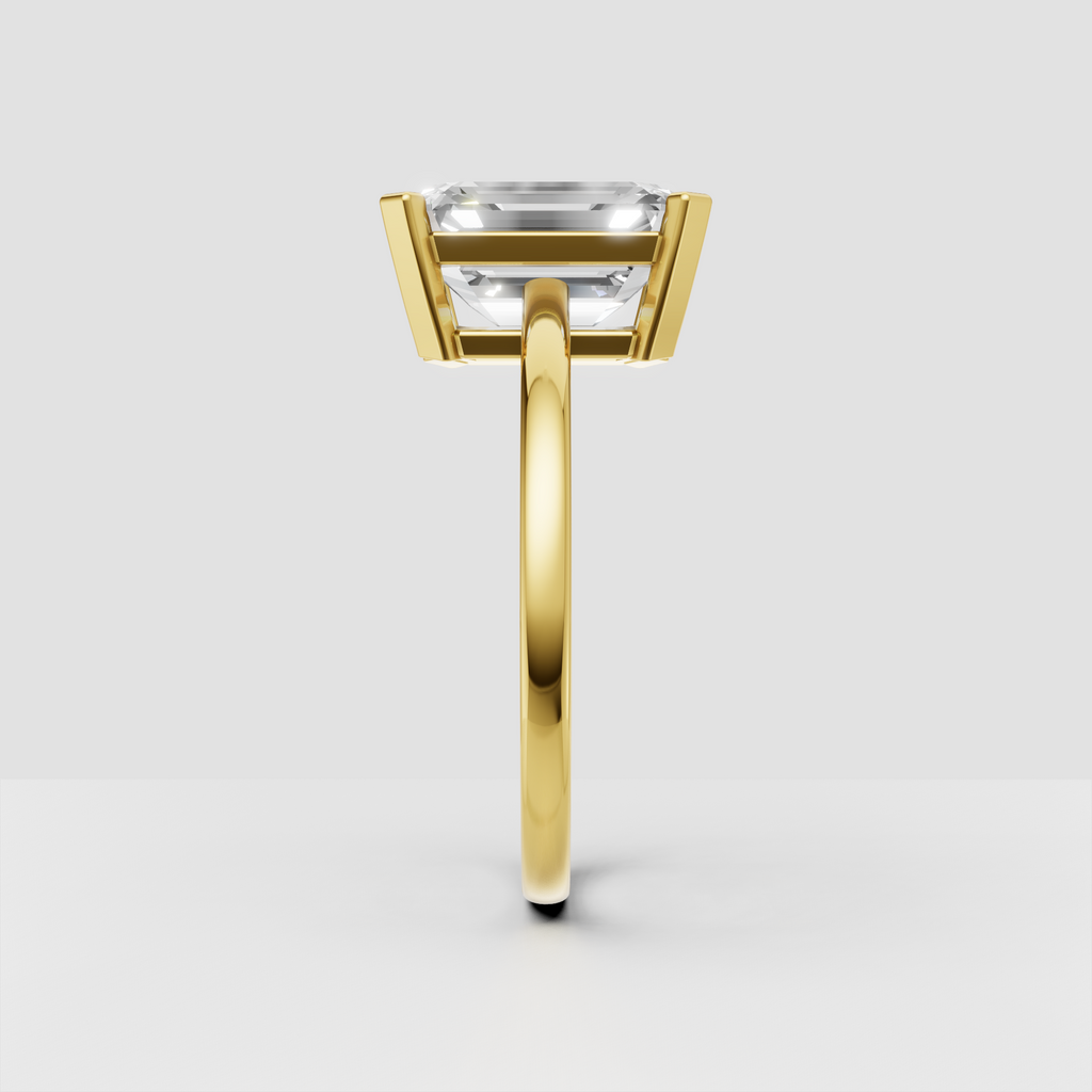Emerald diamond solitaire ring in yellow gold