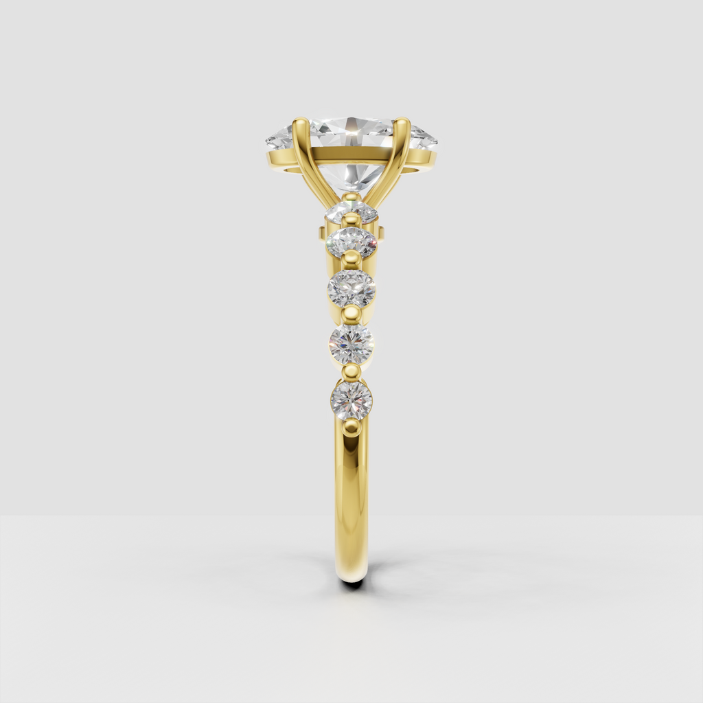 Yellow gold oval cut diamond ring with sparkling round diamonds along the band