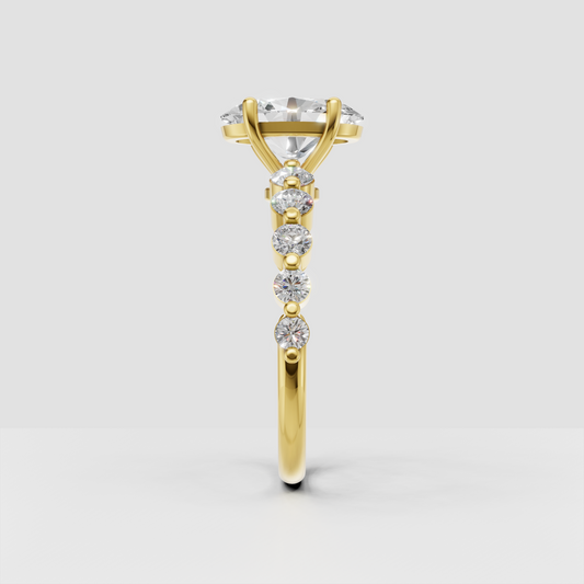 Yellow gold oval cut diamond ring with sparkling round diamonds along the band