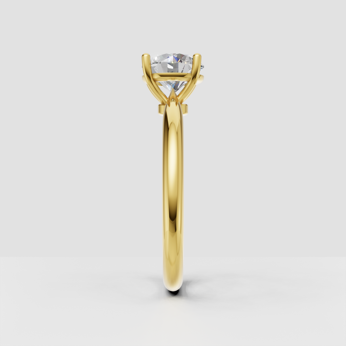 Elegant round cut diamond solitaire ring with polished gold shank
