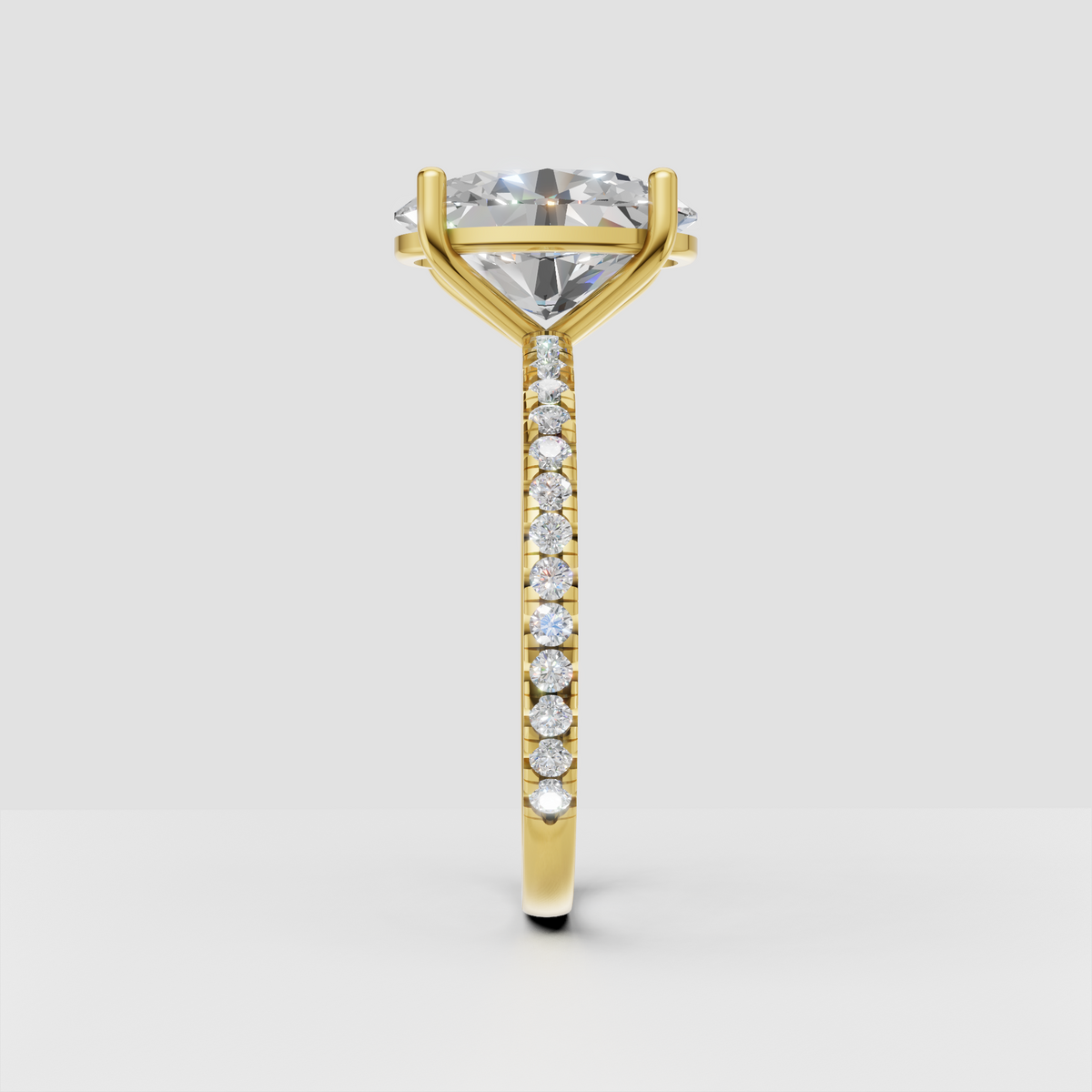 Yellow gold oval diamond ring with cathedral prong setting