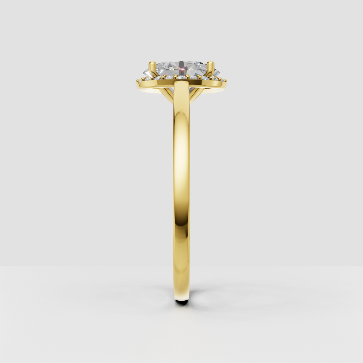 Yellow gold oval diamond ring with four-prong halo setting