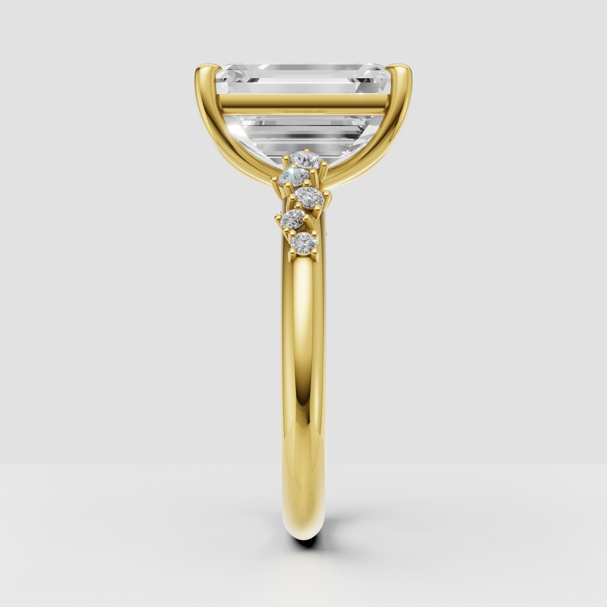 Yellow gold emerald cut engagement ring with side stones