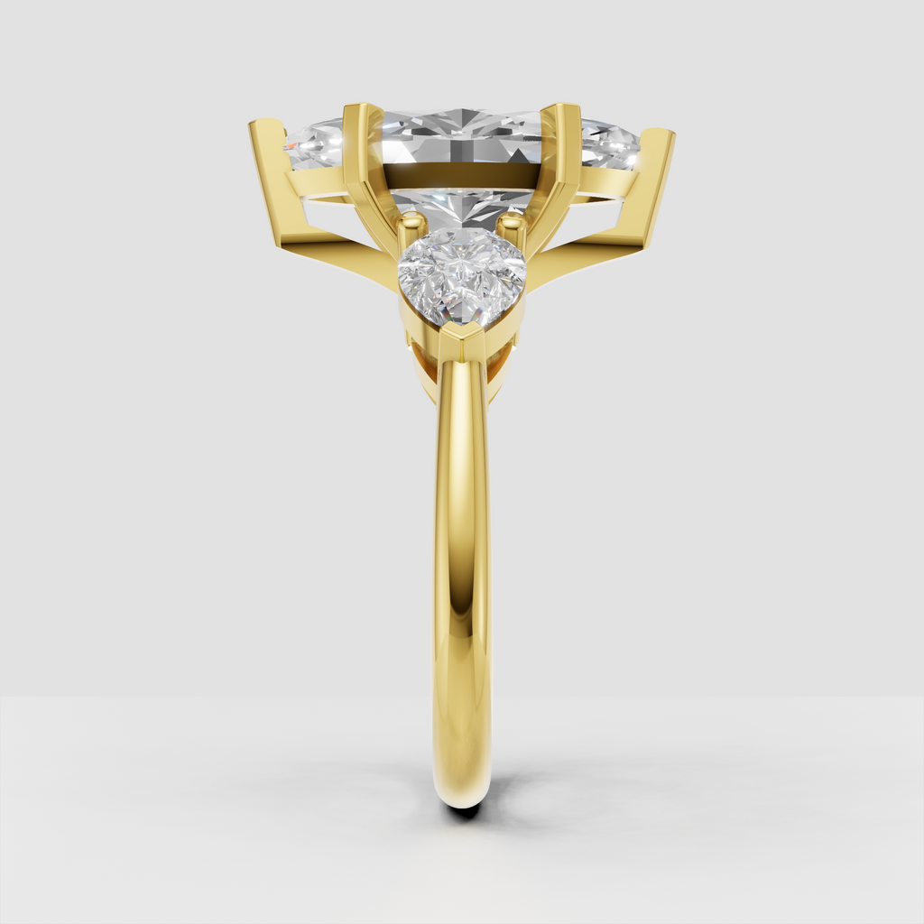 Three stone marquise diamond engagement ring with pear accents