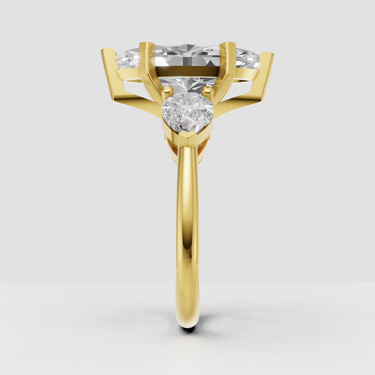 Three stone marquise diamond engagement ring with pear accents