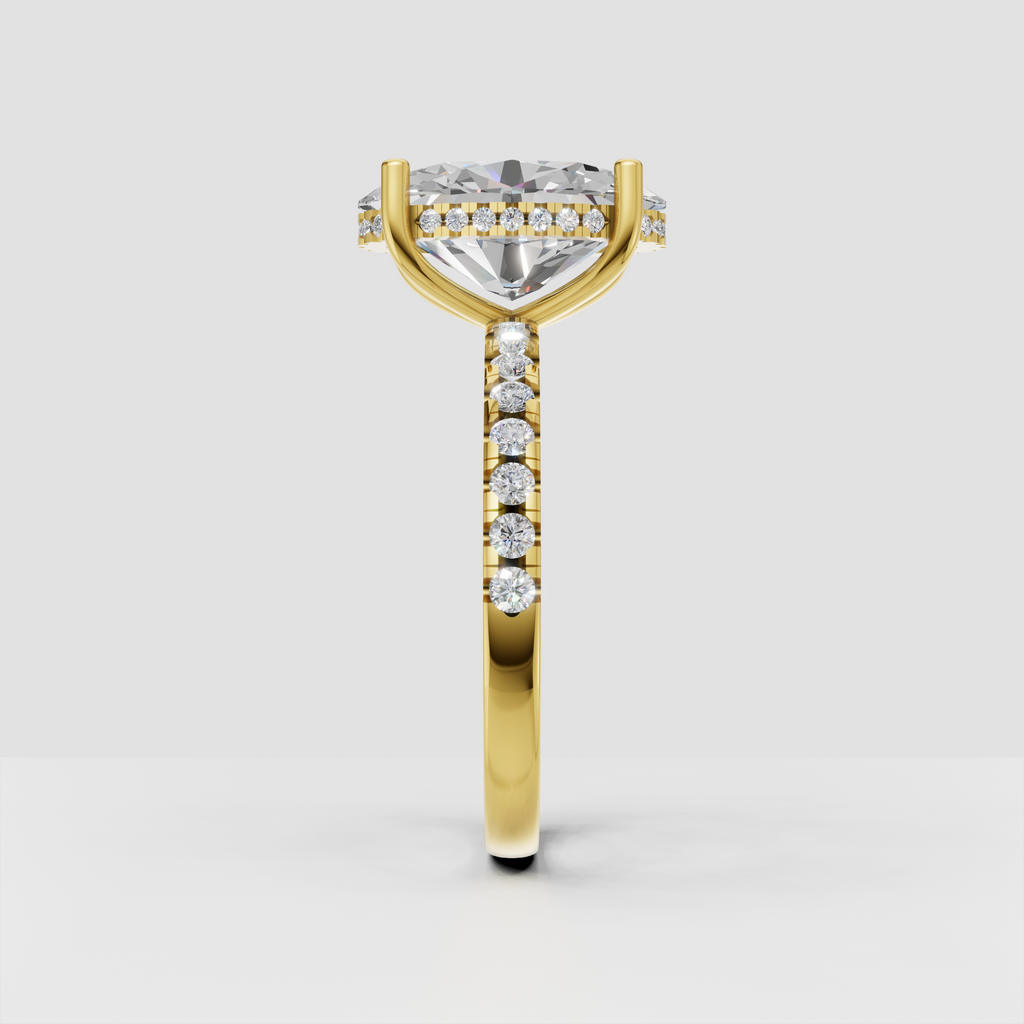 Oval cut diamond solitaire ring with yellow gold prong setting
