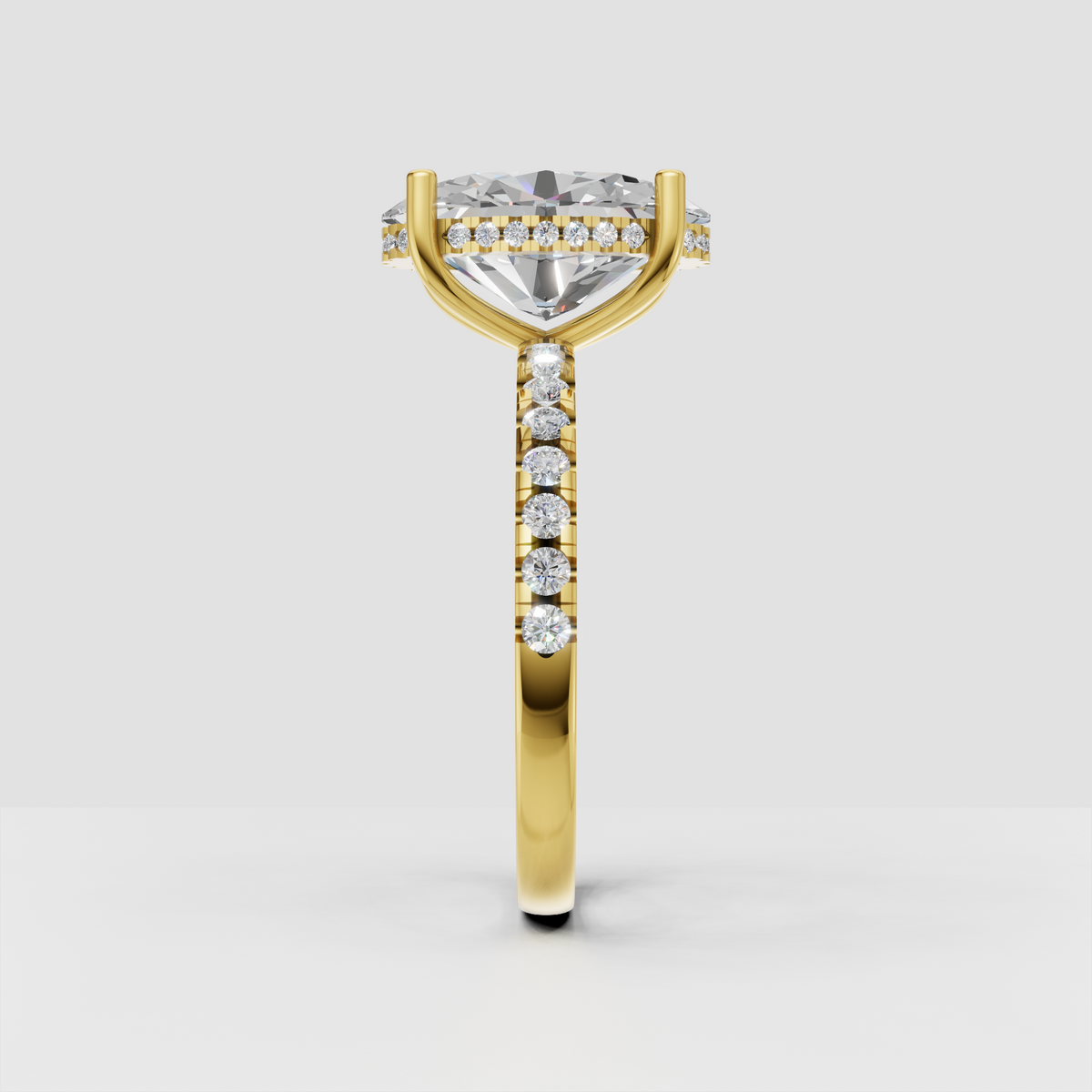Oval cut diamond solitaire ring with yellow gold prong setting