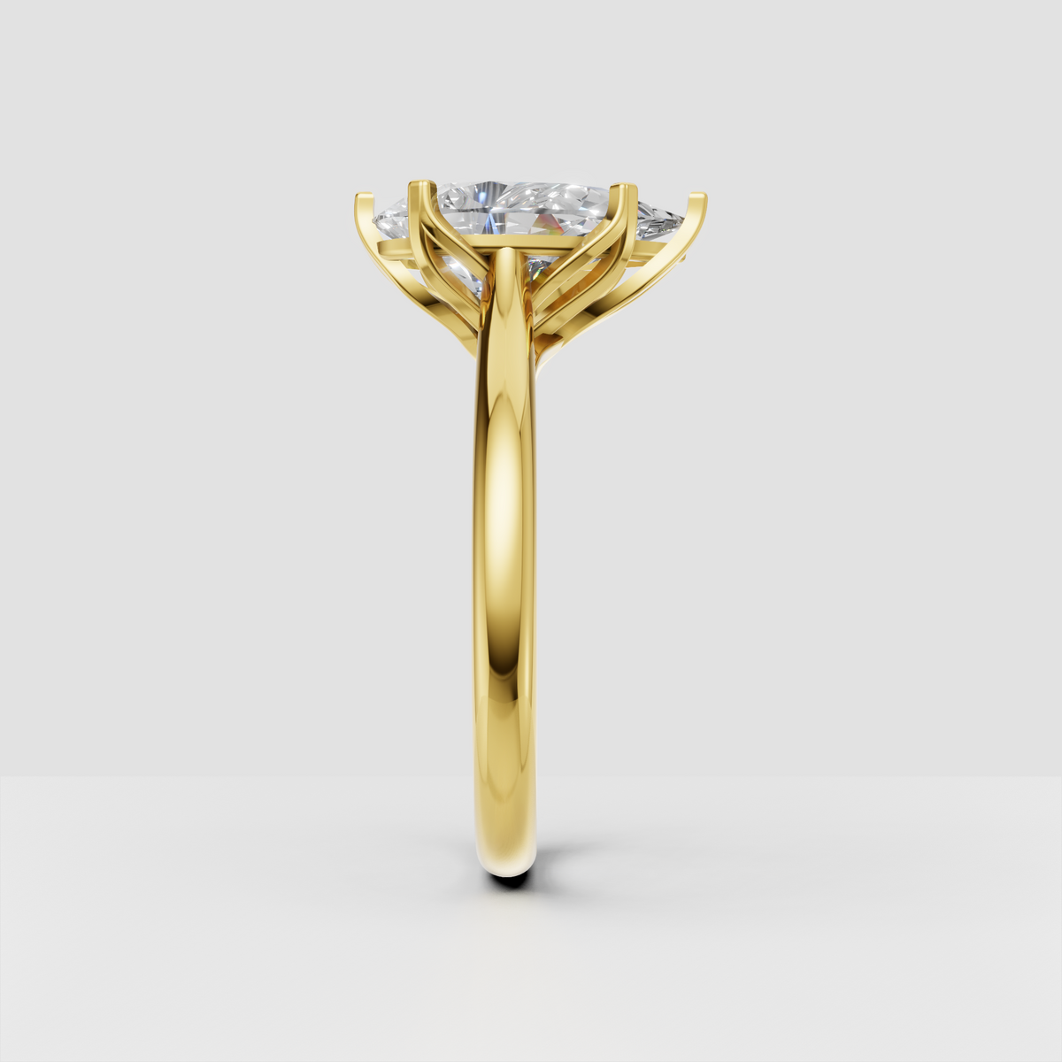 Pear-shaped center diamond ring in polished yellow gold