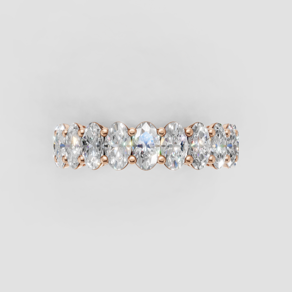 Yellow gold eternity ring with aligned oval diamonds