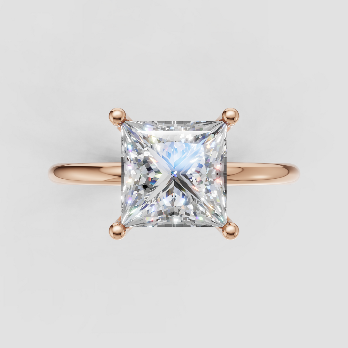 Front view of princess cut diamond engagement ring with square center stone and polished gold band