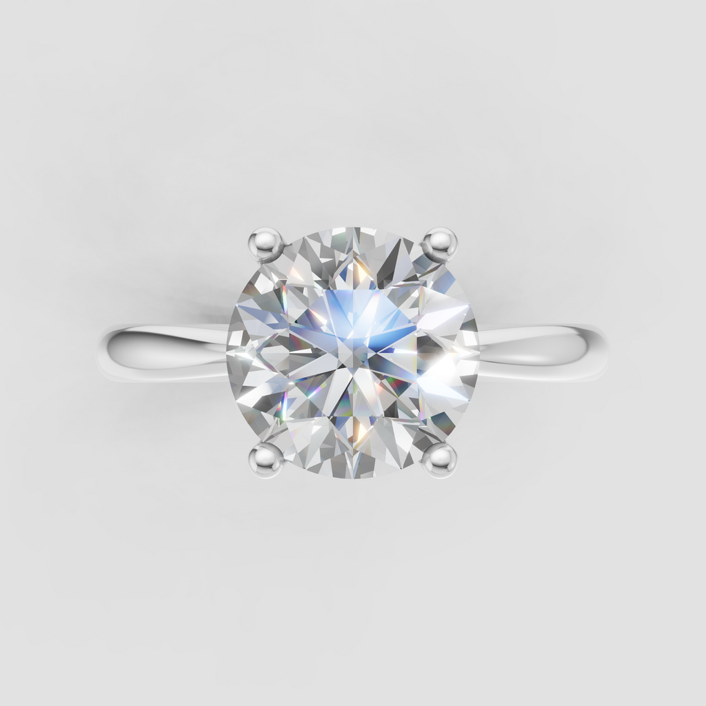 Yellow gold engagement ring featuring a round diamond center stone