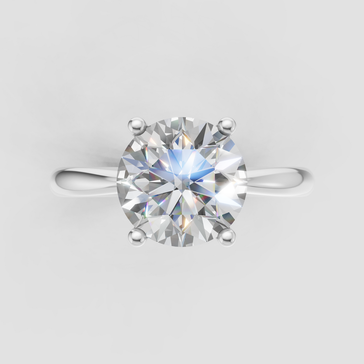 Yellow gold engagement ring featuring a round diamond center stone