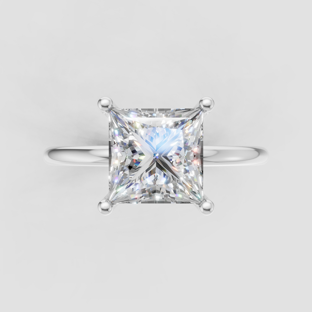 Classic princess cut diamond solitaire ring in yellow gold with a refined four-prong setting and polished band