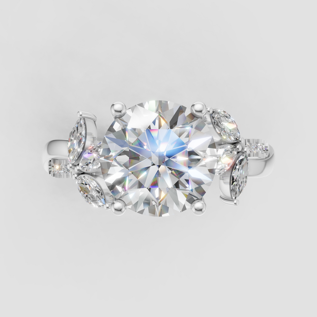 Round diamond bridal ring with marquise side stones and pave shoulders