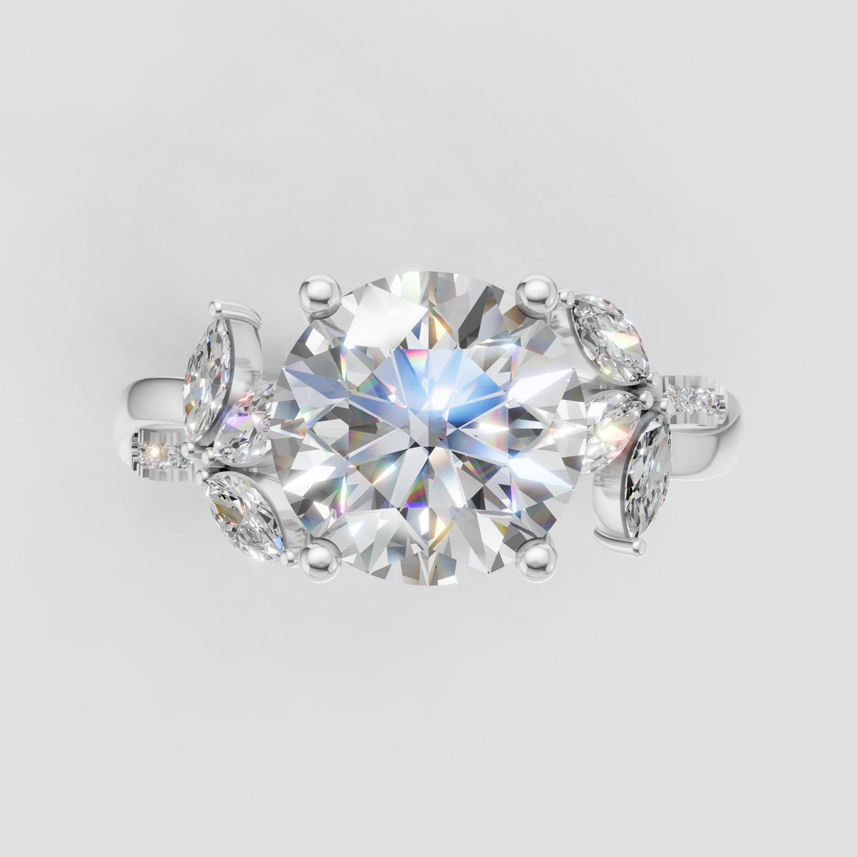 Round diamond bridal ring with marquise side stones and pave shoulders