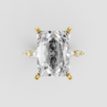 Radiant cut diamond engagement ring with four-prong yellow gold setting and side stones