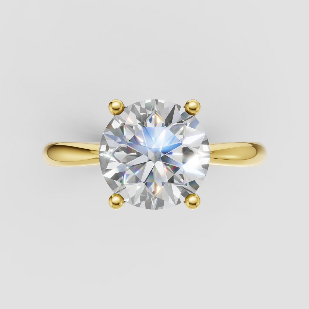 Round diamond engagement ring with polished gold band and prong setting