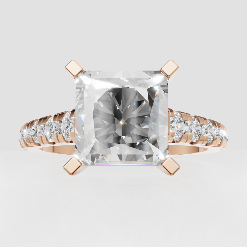 Yellow gold engagement ring with radiant center and round side stones