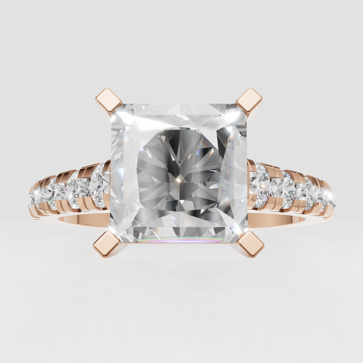 Yellow gold engagement ring with radiant center and round side stones