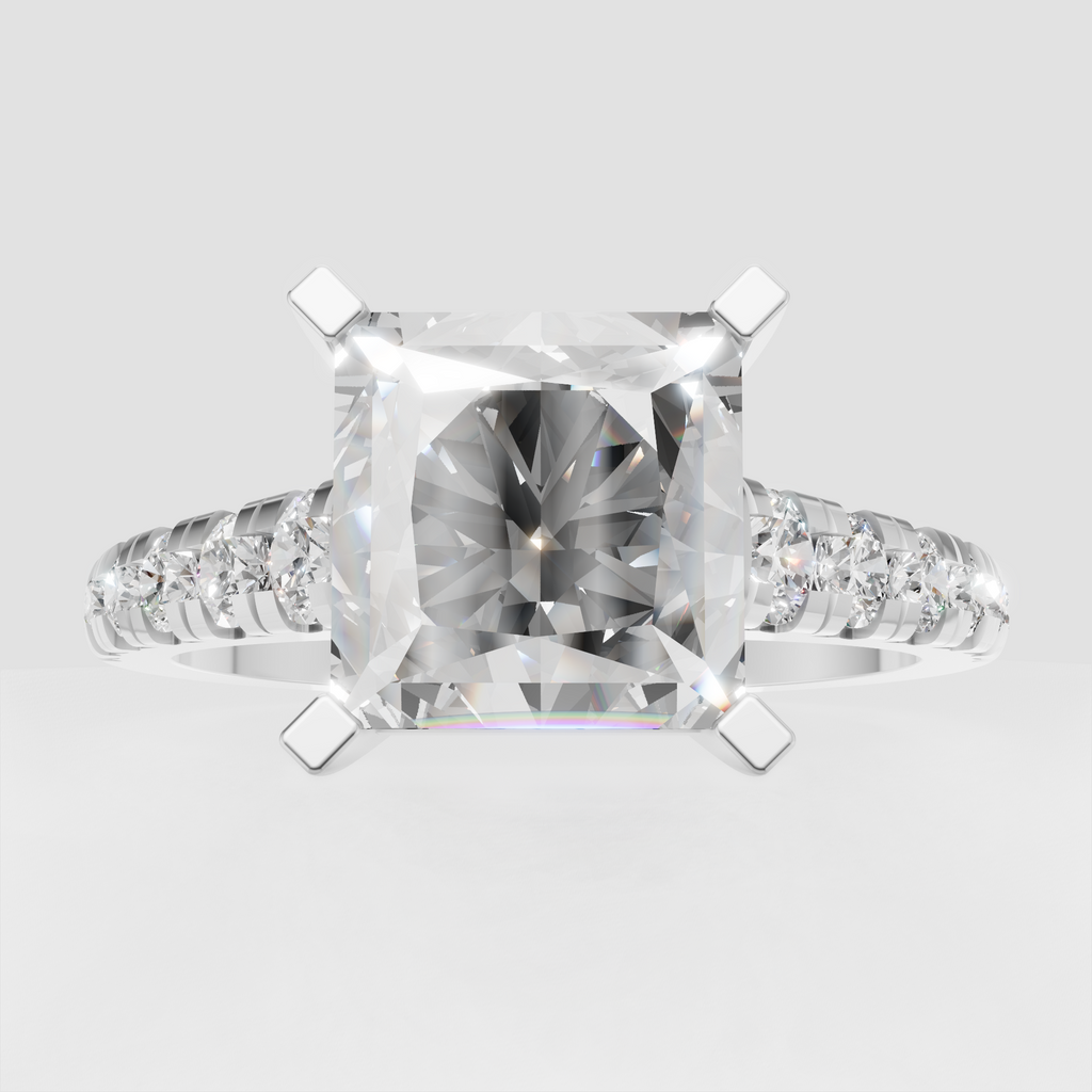 Radiant diamond engagement ring featuring a polished yellow-gold band