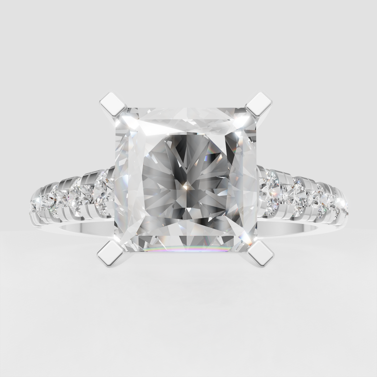 Radiant diamond engagement ring featuring a polished yellow-gold band