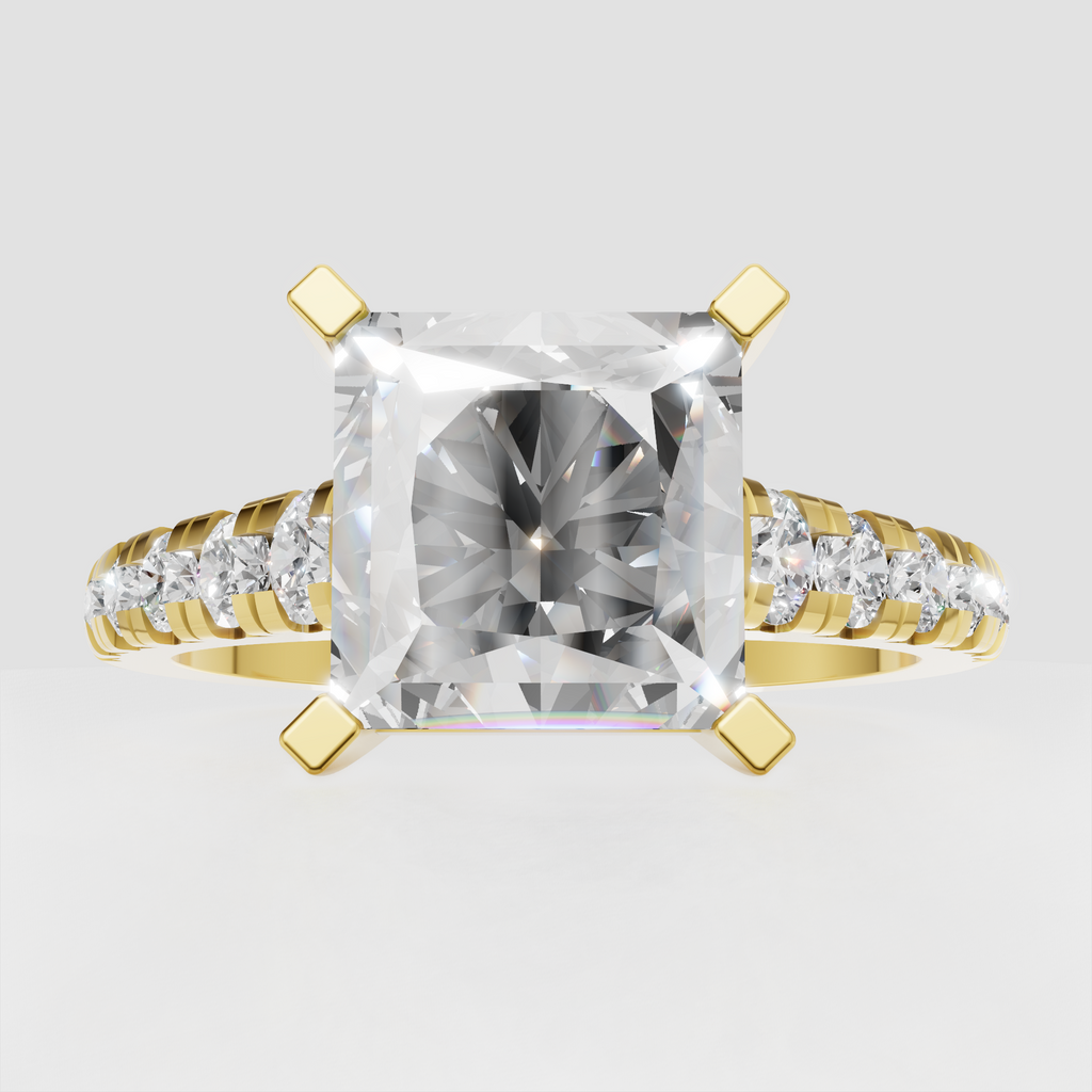 Radiant diamond four-prong engagement ring with pavé side stones in yellow gold